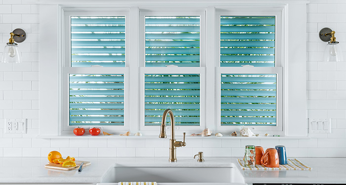 Interior shot of a kitchen counter with Renewal by Andersen windows.